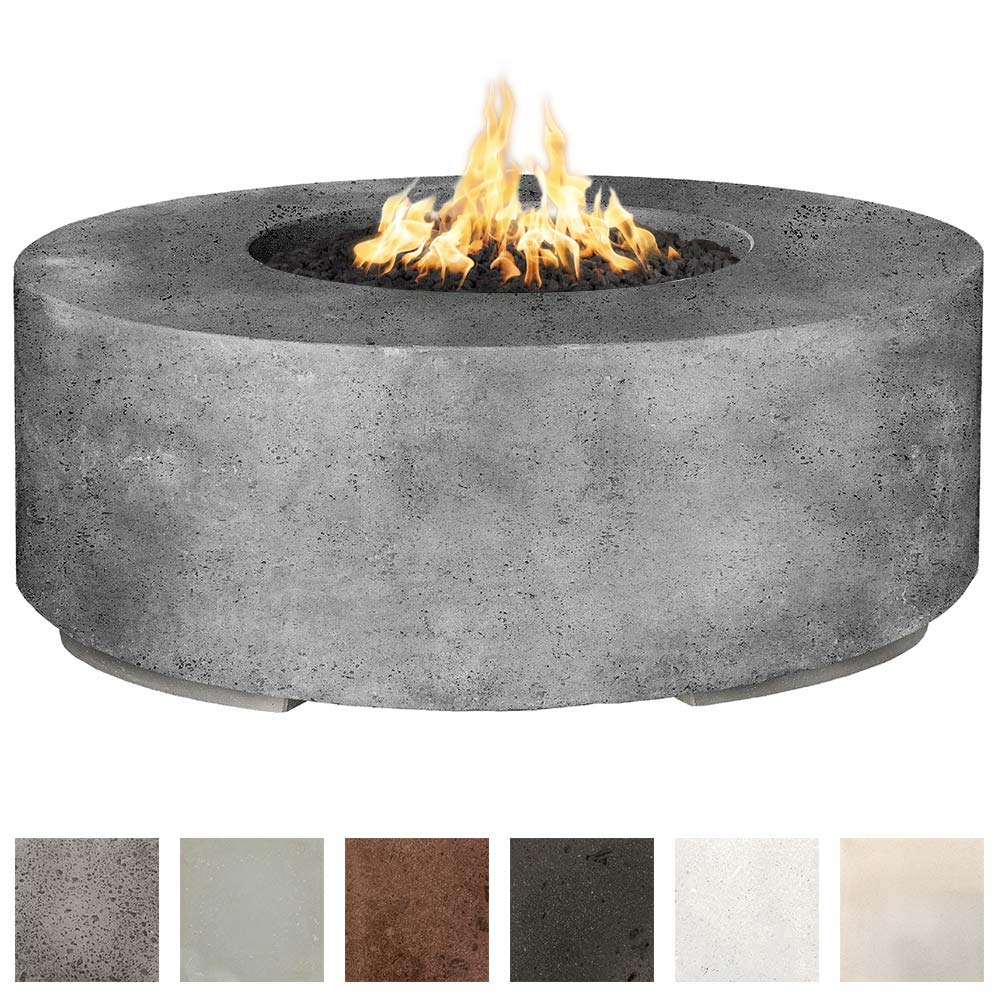 Round concrete gas fire pit with burning flames in a dark gray basin