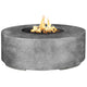Round concrete gas fire pit with burning flames, gray concrete finish