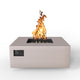 Square gas fire table with open burner and flames, sand-colored finish