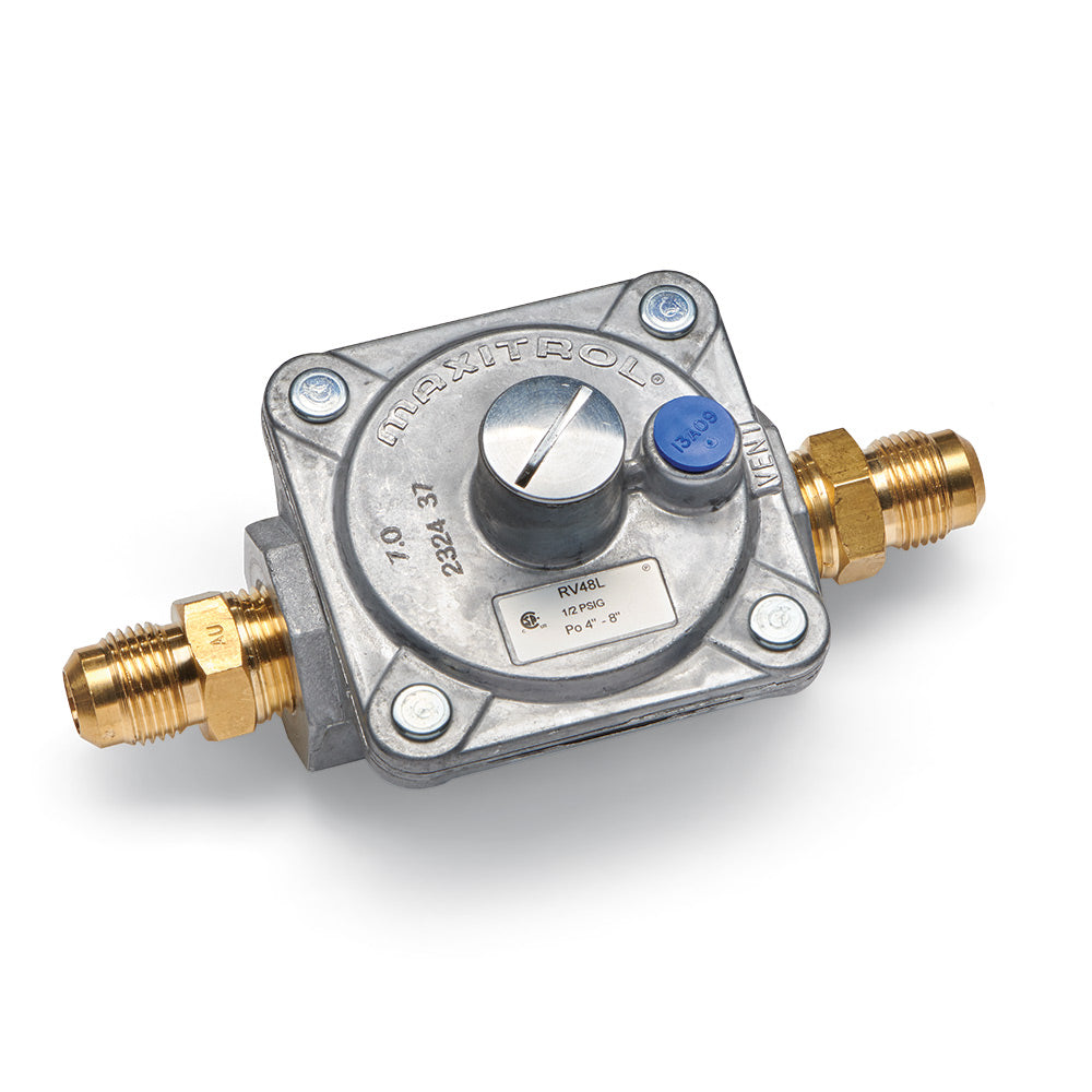Natural gas regulator kit with metal body, blue adjustment knob, and brass fittings