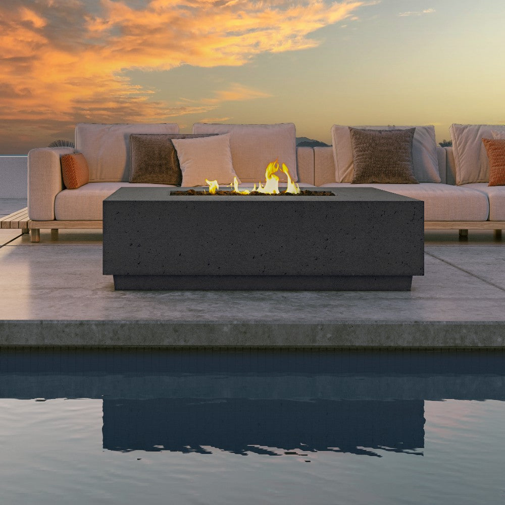 Concrete gas fire table with visible flames and black stone insert