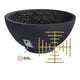 Concrete gas fire bowl in dark with lava rocks and brass gas valve manifold