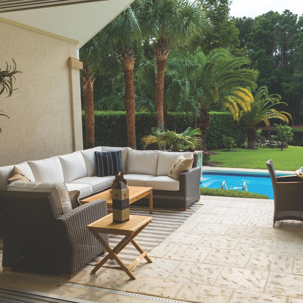 Outdoor sectional loveseat with right arm facing, gray woven frame, light cushions