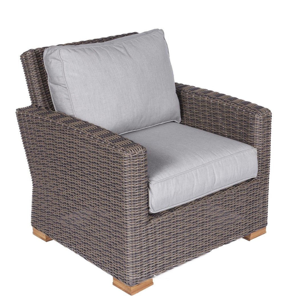 Dark wicker club chair with light gray seat and back cushions