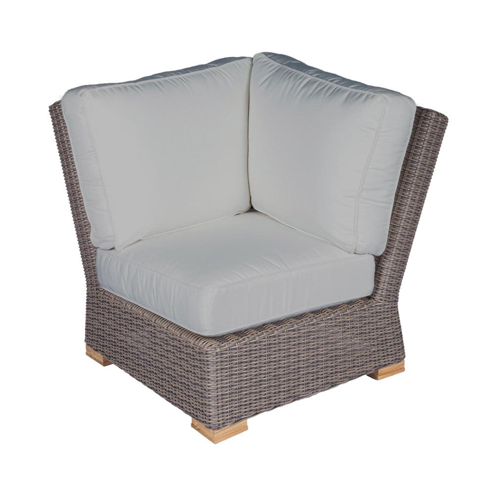 Outdoor corner chair with light gray cushion and dark wicker frame