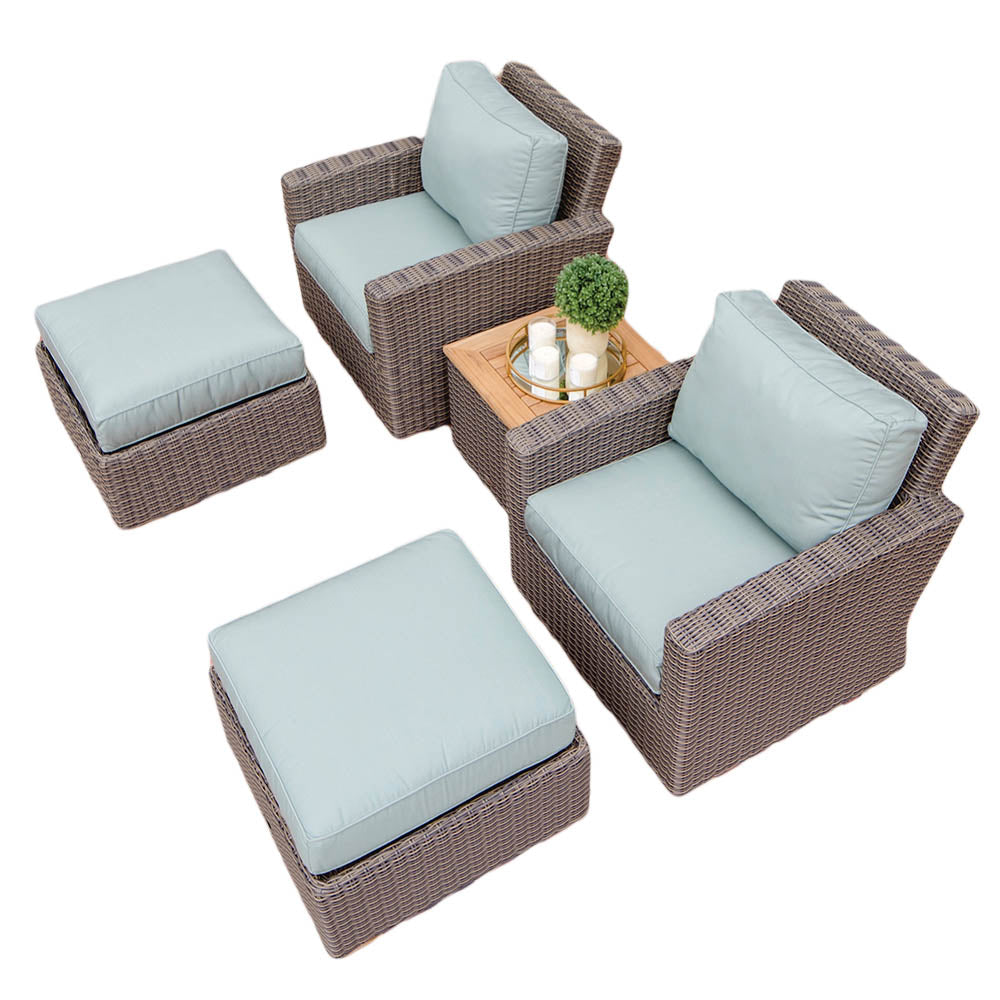 Outdoor seating set with light blue cushions, woven frames, and matching ottomans