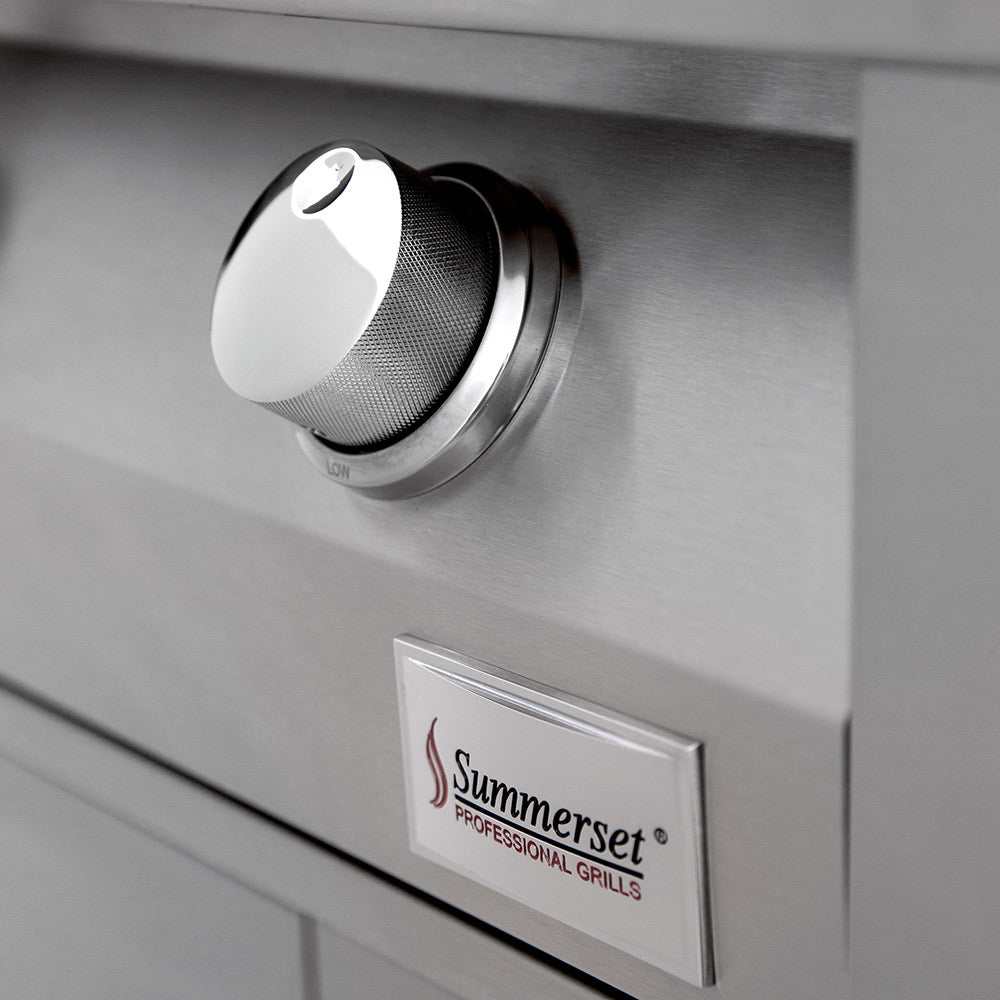Summerset gas grill control knob and brand plate on stainless steel cabinet