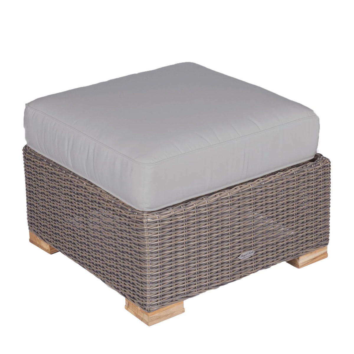 Woven wicker ottoman with light gray upholstered cushion and wood feet