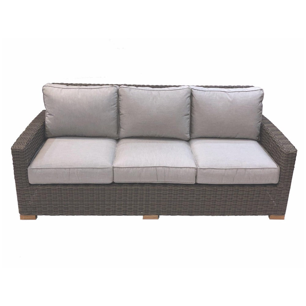 Outdoor sofa with dark wicker frame and light gray/white cushioned back and seat