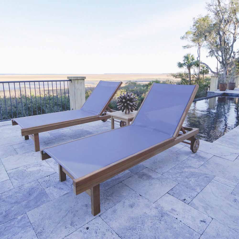 Teak chaise lounge chair with blue sling seat, adjustable back, rolling casters