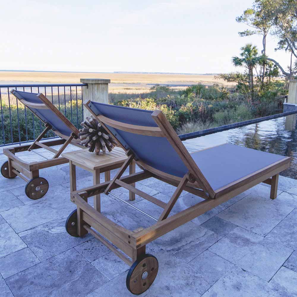 Teak chaise lounge set with blue sling seats, adjustable backs, rolling casters