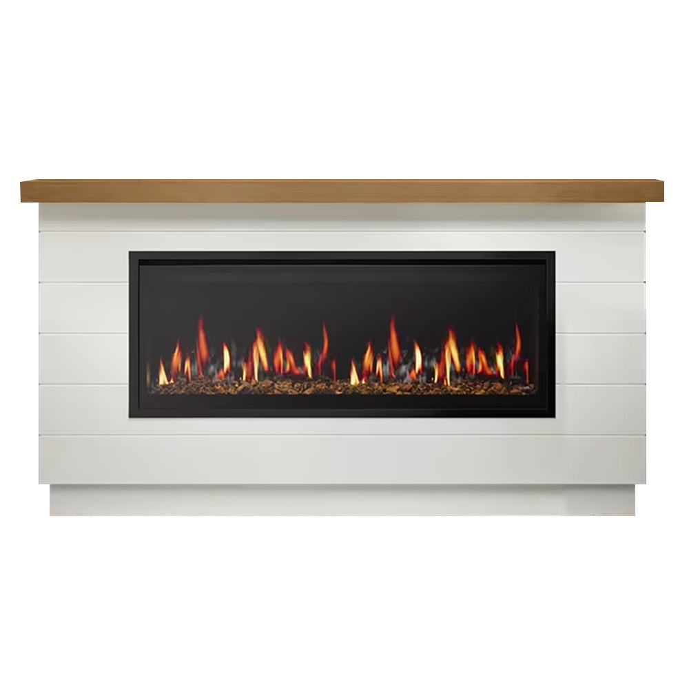 Electric fireplace insert in white farmhouse mantel with dark glass and wood top