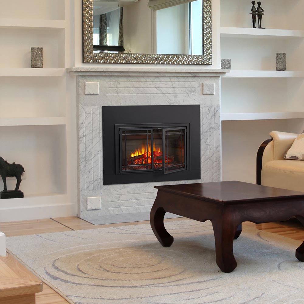 Black electric fireplace insert with flames behind glass inside a gray stone surround