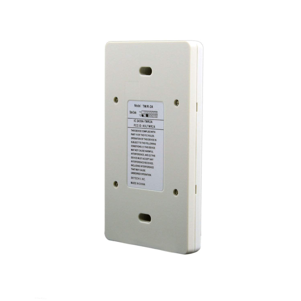 Transmitter remote back panel in light gray with screws and specifications label