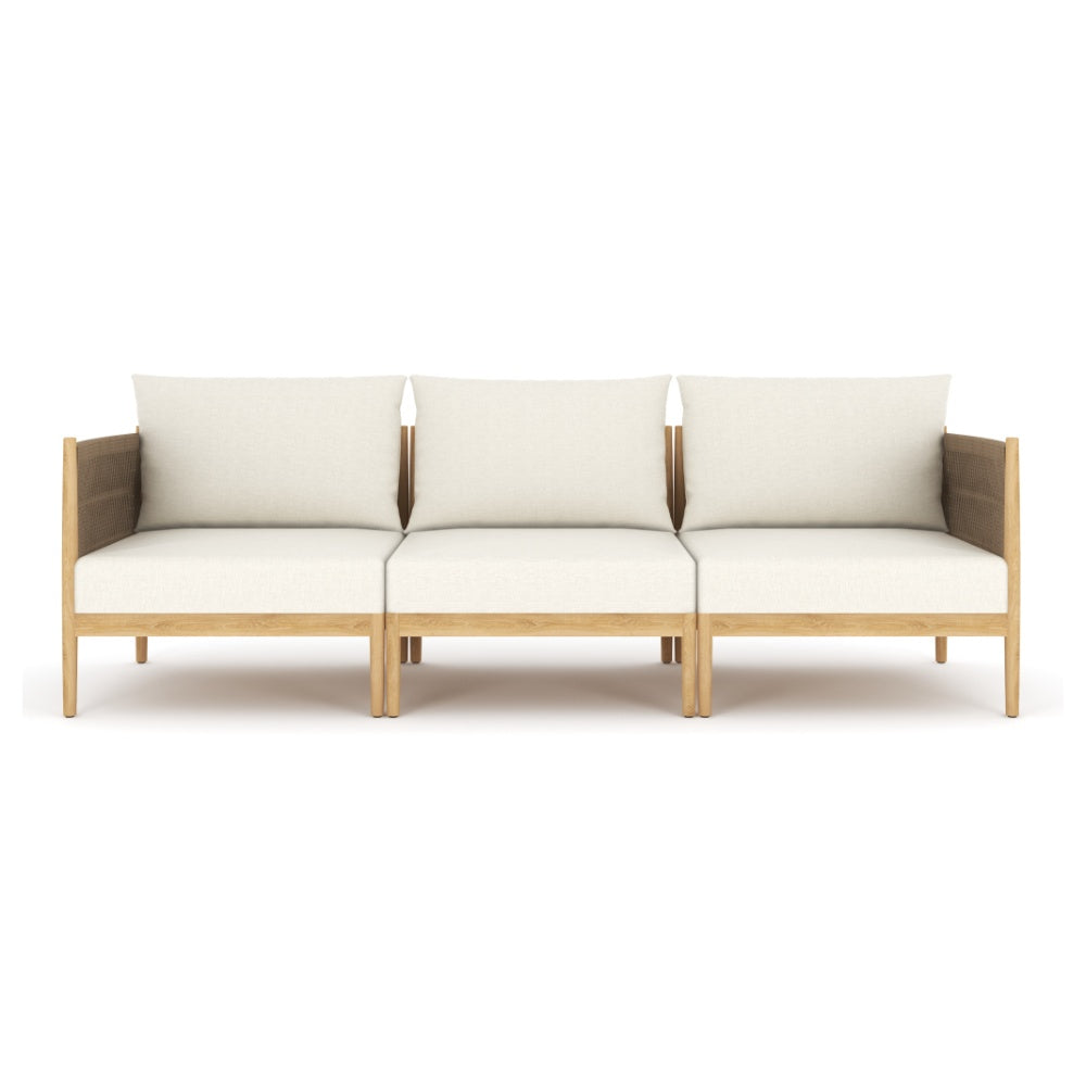 Outdoor modular sofa with three beige seat cushions and light teak wood frame