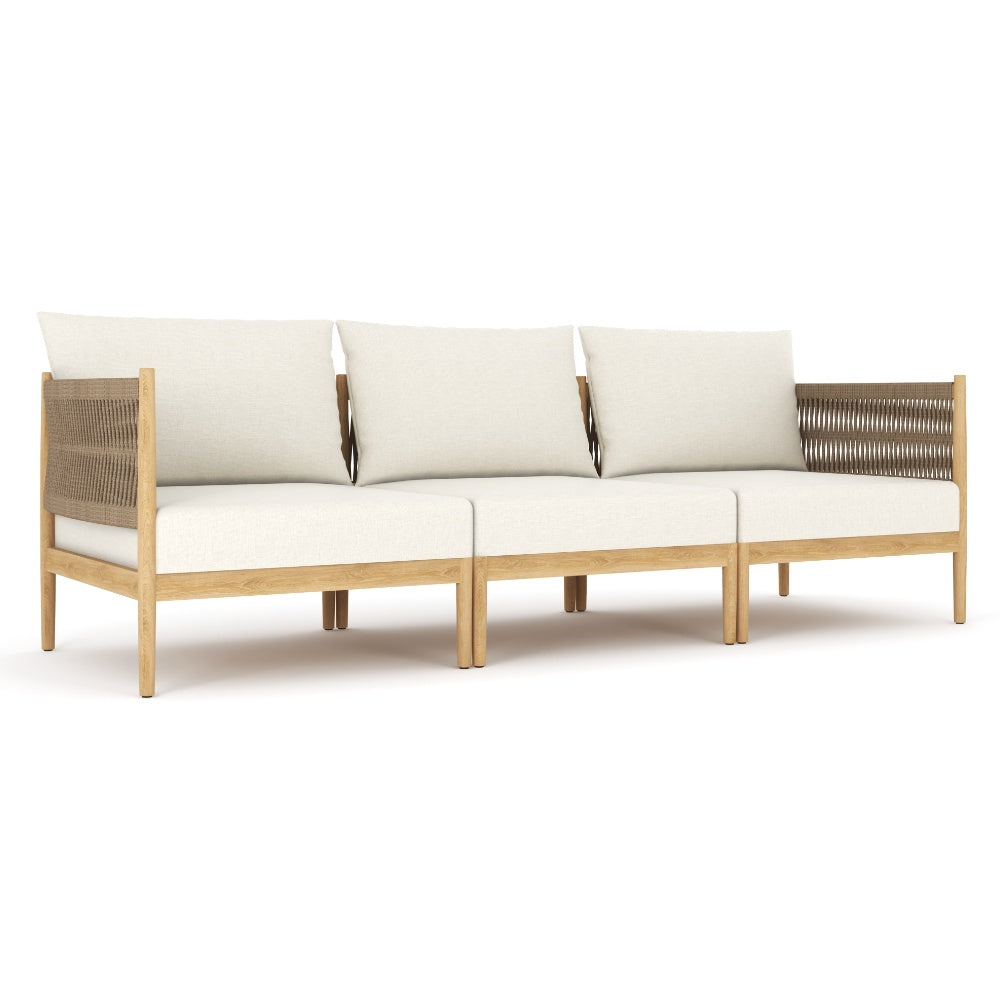 Outdoor modular sofa with three beige cushions and dark woven arm/back panels