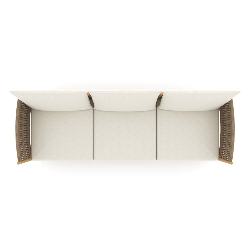 Outdoor modular sofa with three beige back cushions and dark woven side supports