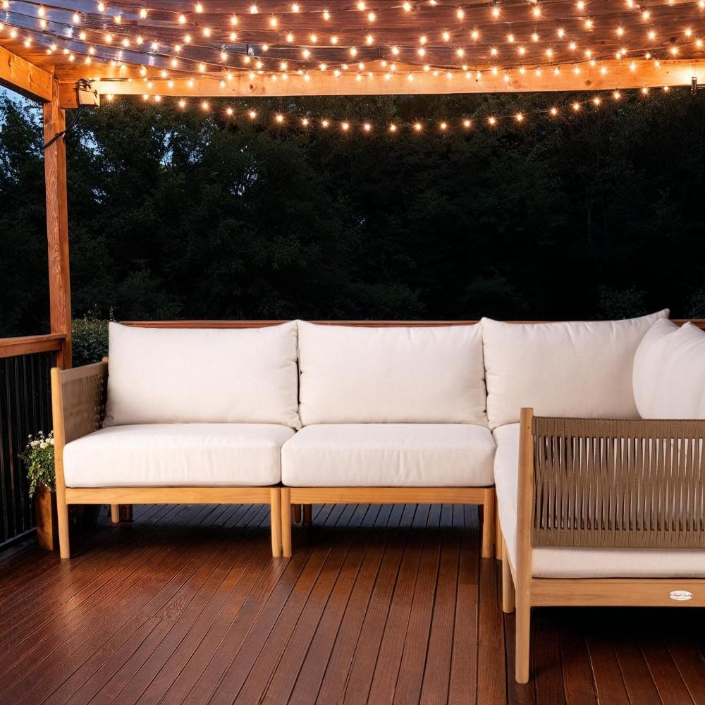 Outdoor sectional sofa with light beige cushions and woven tan side/back panels on teak frame