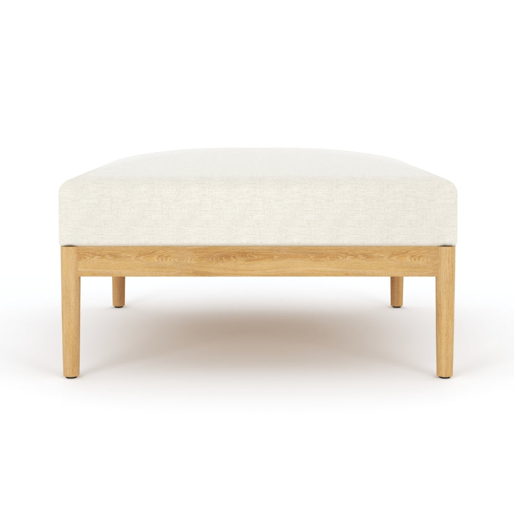 Teak ottoman with light beige cushion and four tapered legs