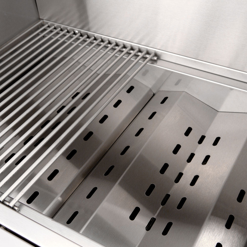 Stainless steel cooking grates over heat plates inside the gas grill