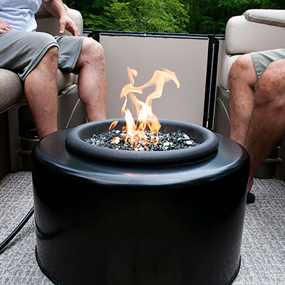 Portable round fire pit with flames, black bowl outdoors