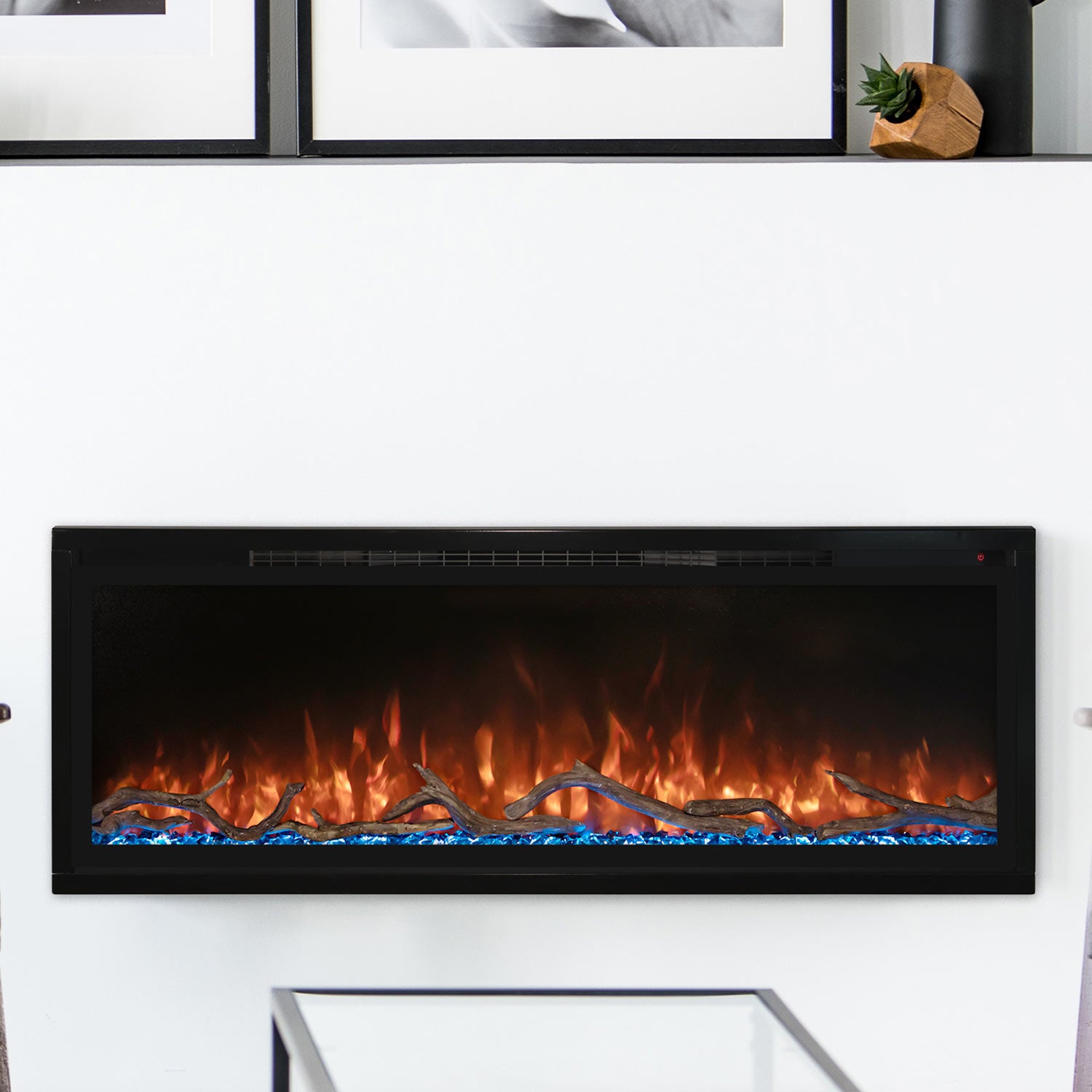 Modern Flames slimline electric fireplace, black wall-mounted unit with orange flame display