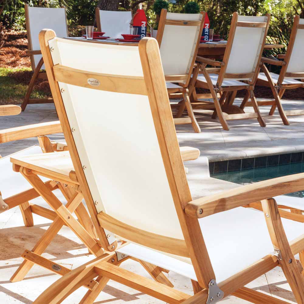Teak sling steamer lounge chair with white fabric seat and back