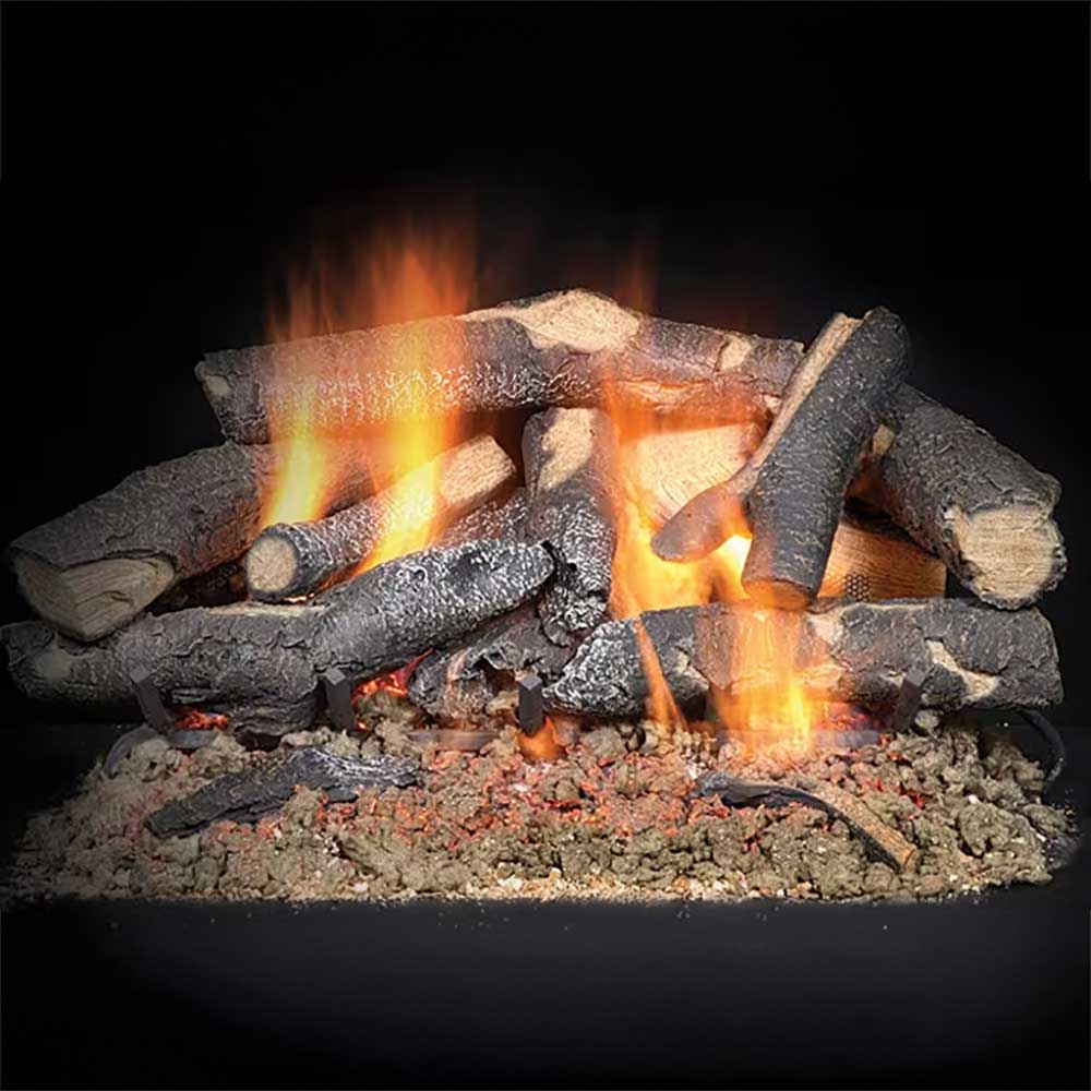 Gas log set with vented logs and glowing embers, showing active orange flames.