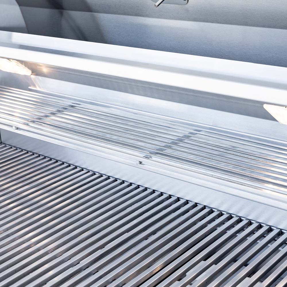 Stainless cooking grates with a warming rack above inside the lid
