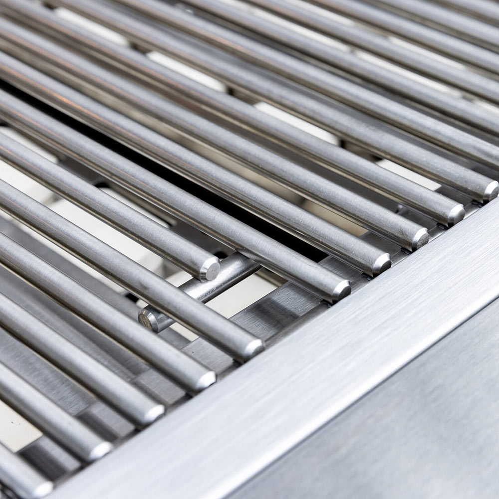 Built-in gas grill stainless burner tubes and grate supports inside firebox