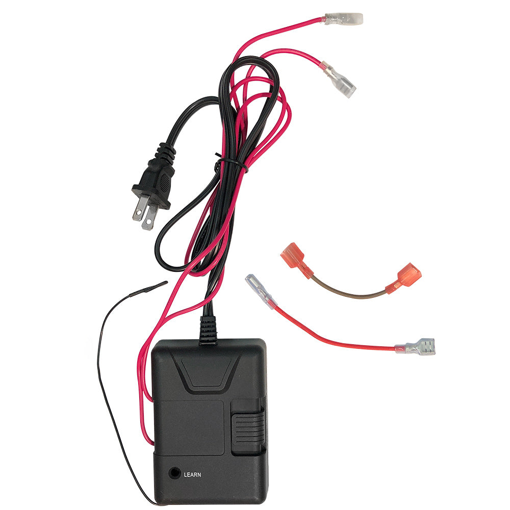 Black receiver box with connected red and black cables, USB-style adapter and leads