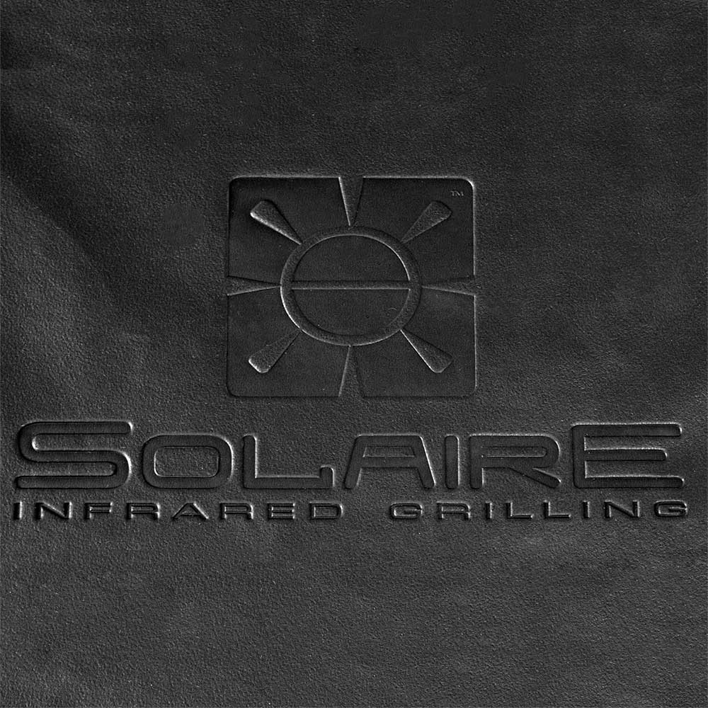 Solaire infrared grilling burner cover close-up with starburst logo and embossed text
