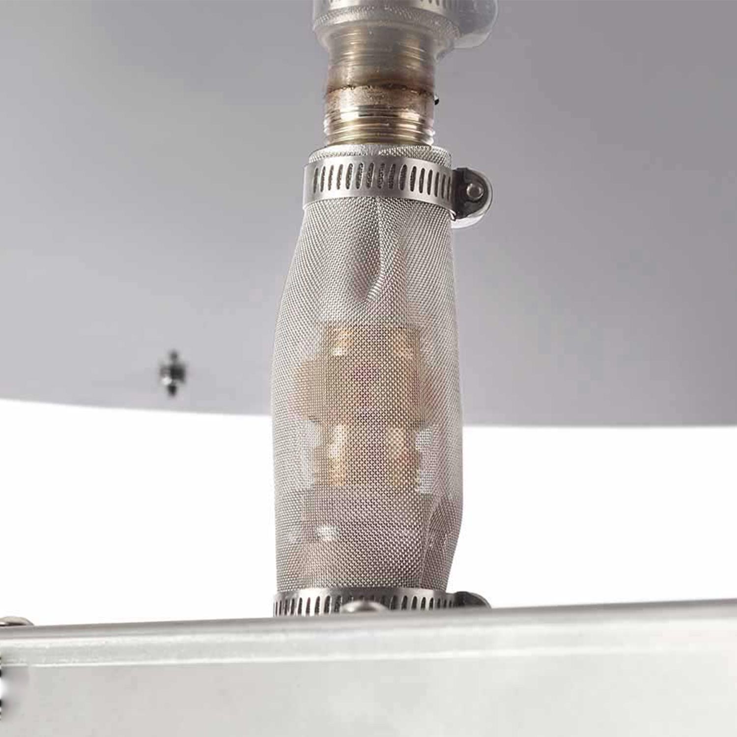 Gas fire pit burner head with mesh screen and gas tube connection