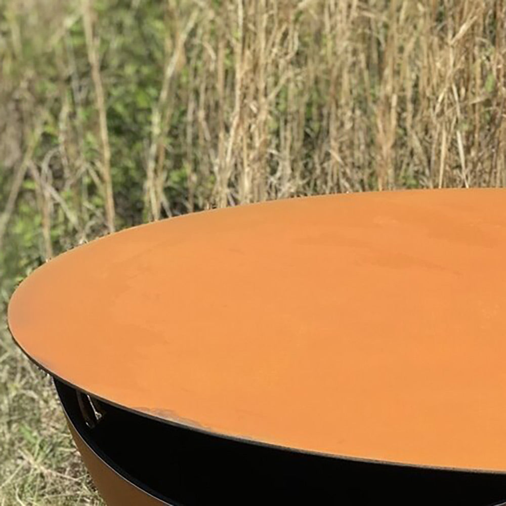 Orange round fire pit table top with smooth metal surface, 43-inch diameter