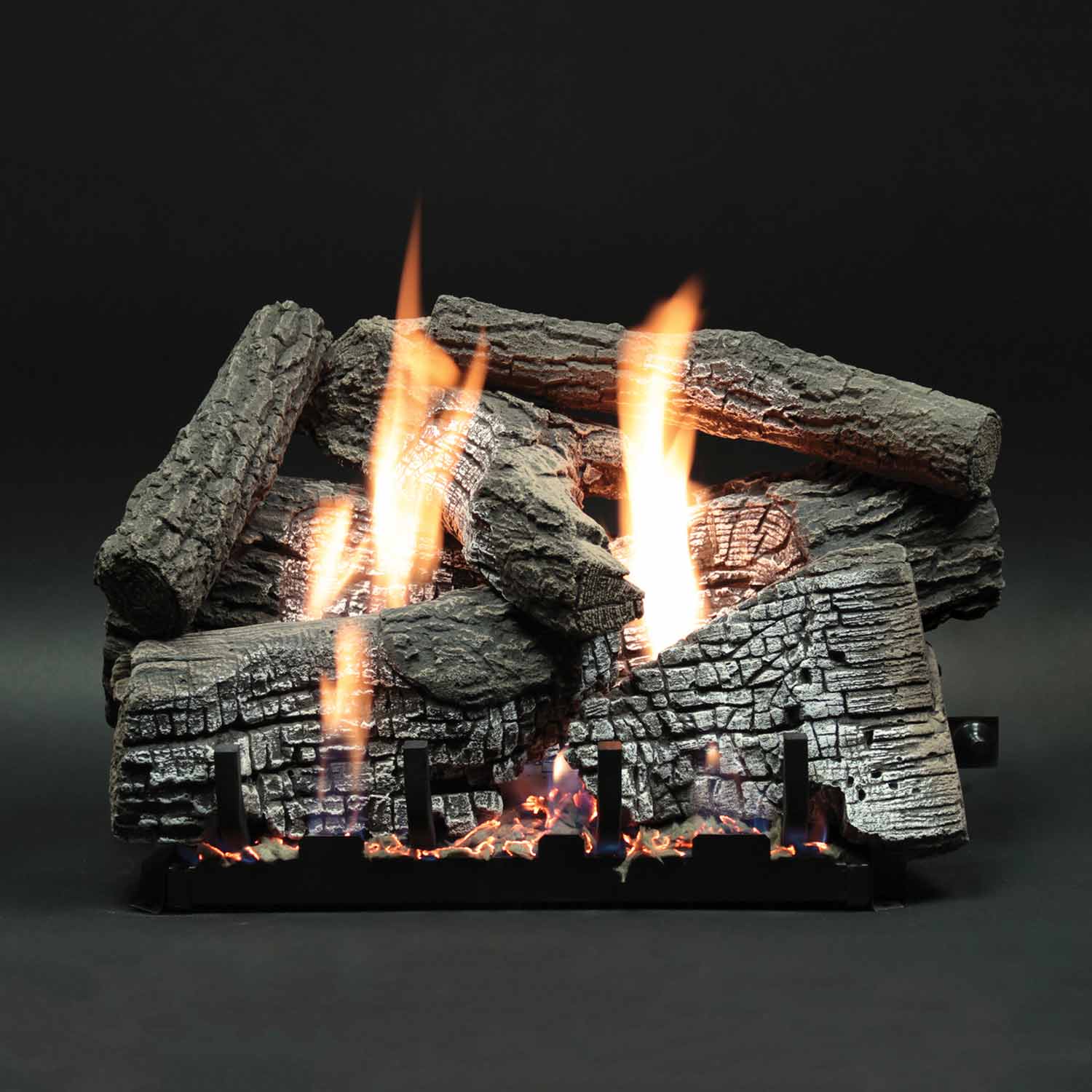 Vented refractory fireplace log set with tall flames on stacked logs