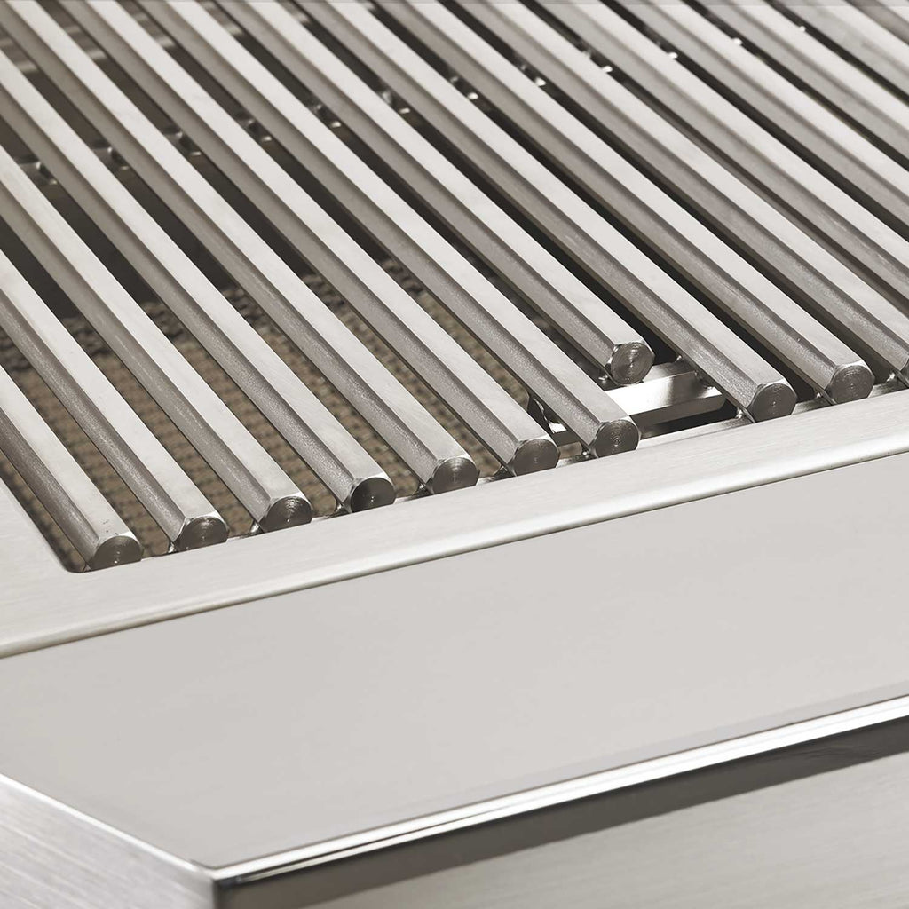 Stainless steel grill grates with parallel bars in an open cooking hood
