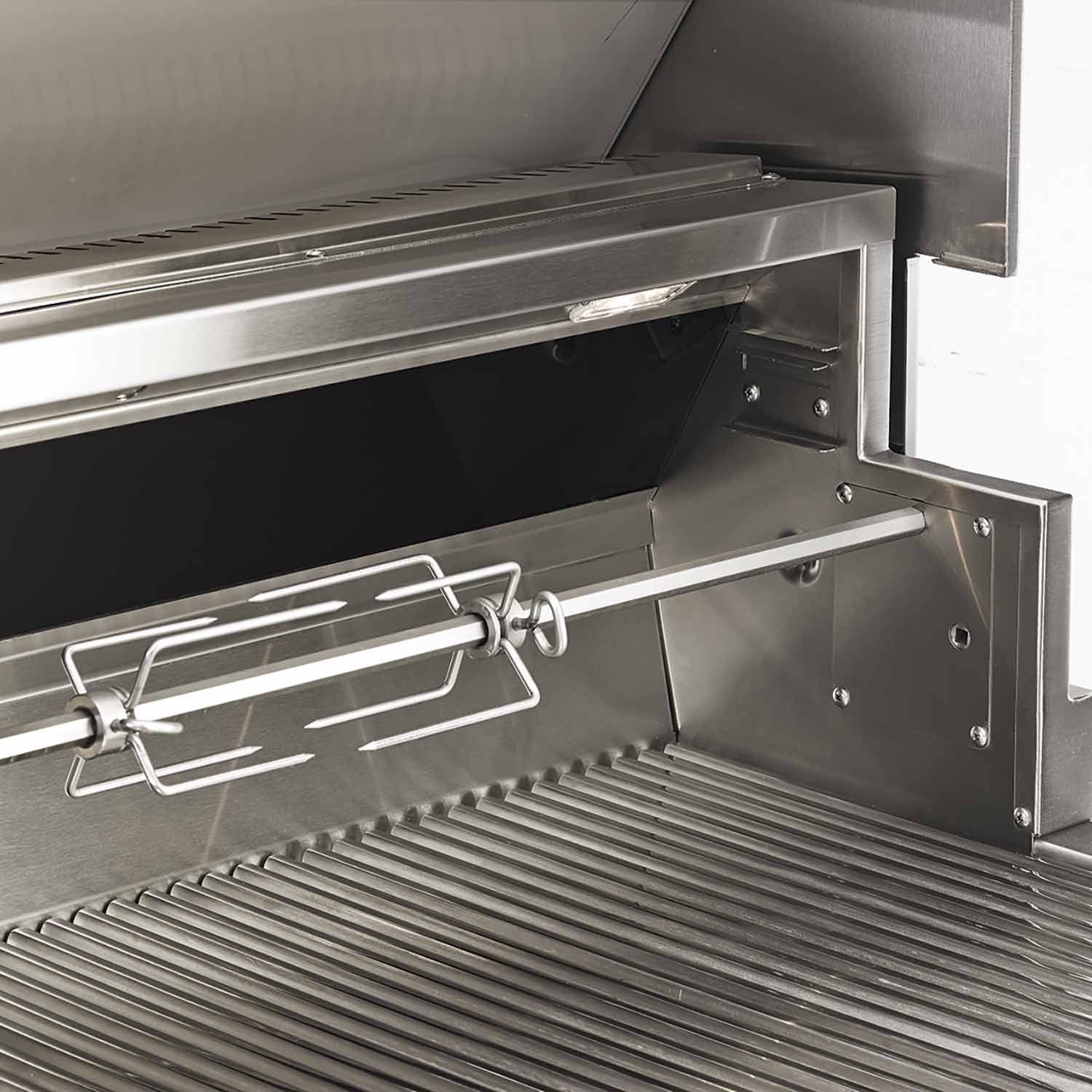 Gas grill interior with warming rack and cooking grates under open hood