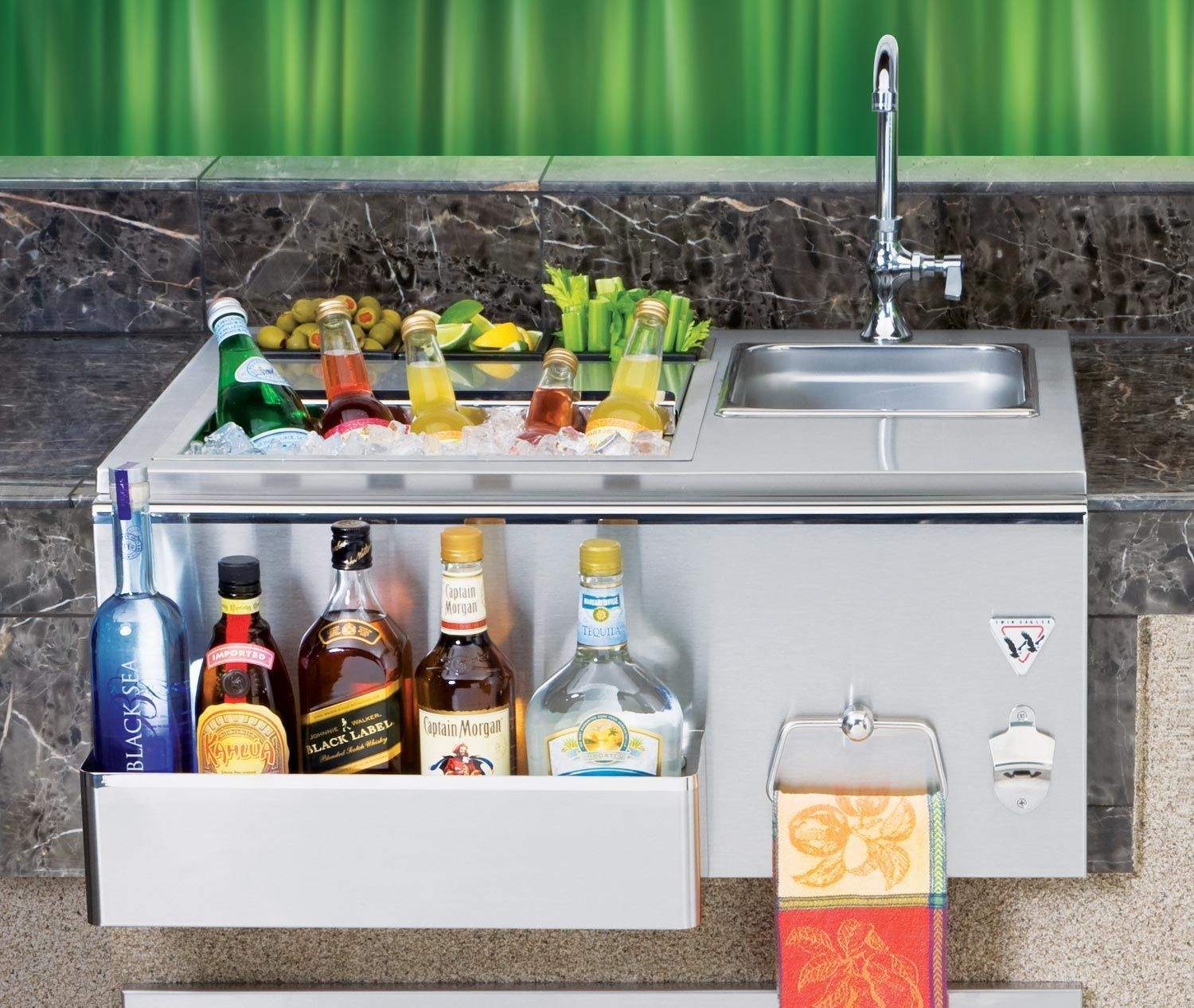 Stainless steel outdoor bar cabinet with sink and faucet, shelves with bottles, towel