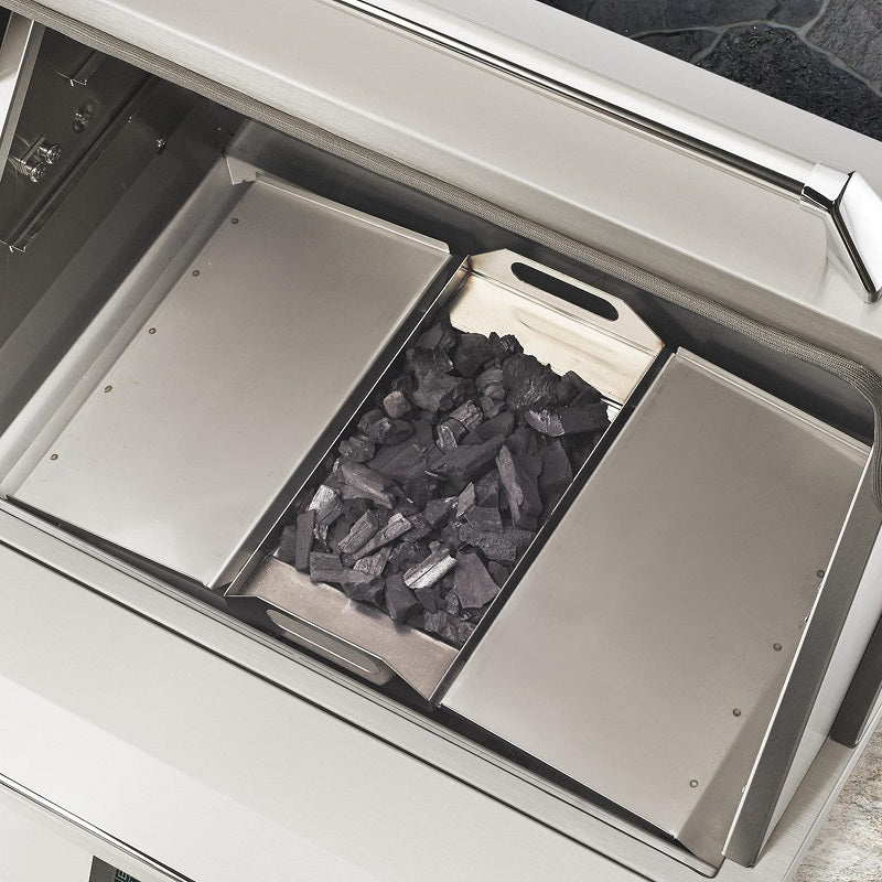 Pellet smoker firebox with grill grates and a tray filled with pellets