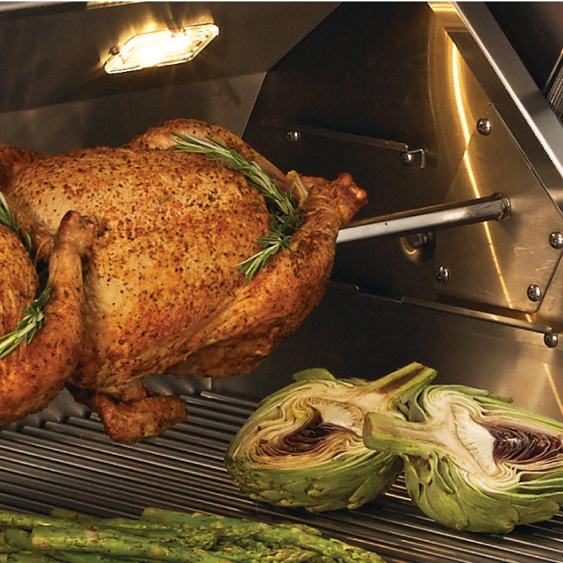Pellet smoker grill with roasted chicken and grilled artichoke on grates