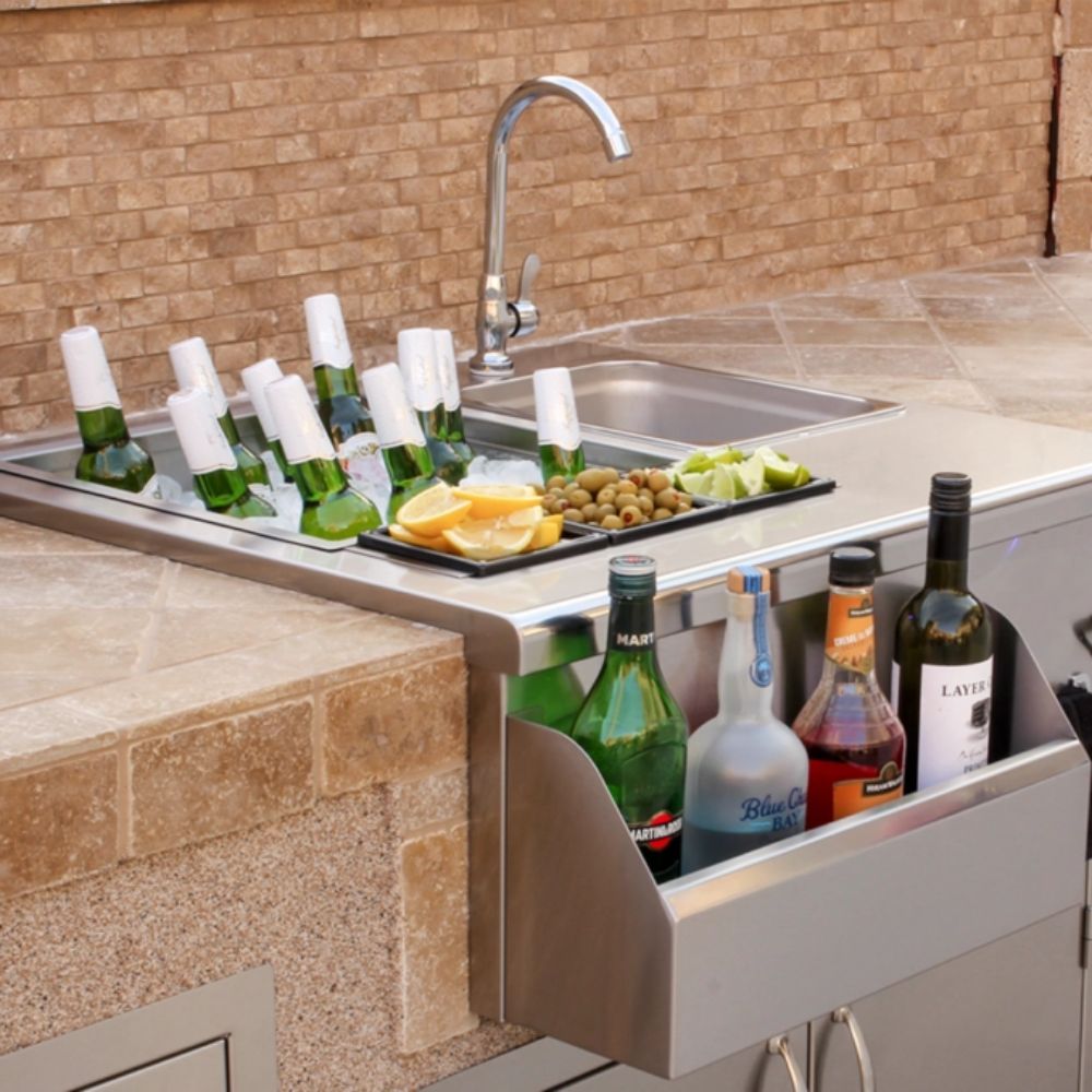 Stainless outdoor beverage station with faucet, sink, prep tray, and bottles