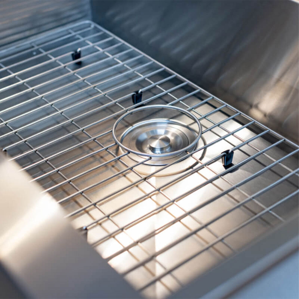 Stainless steel sink basin with metal drying rack and round drain strainer