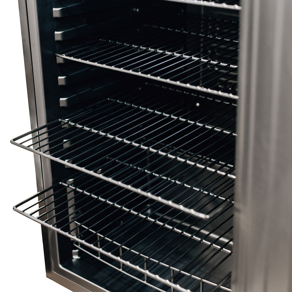 Refrigerator interior with multiple wire shelves, door open and ready for storage.