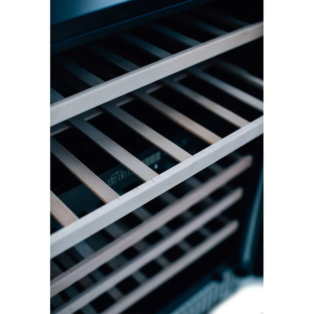 Wine cooler interior racks with metal slats and bottles on shelves