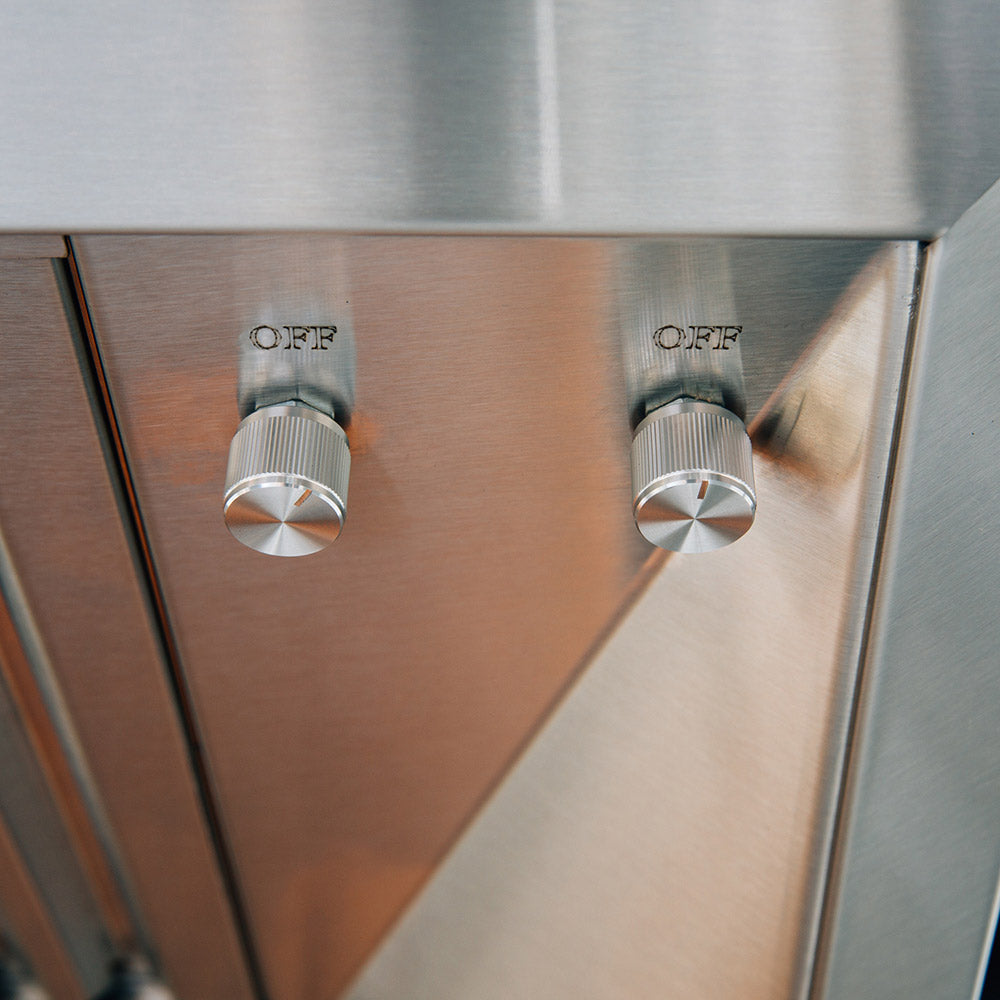 Outdoor vented hood control panel with two OFF knobs on stainless steel face