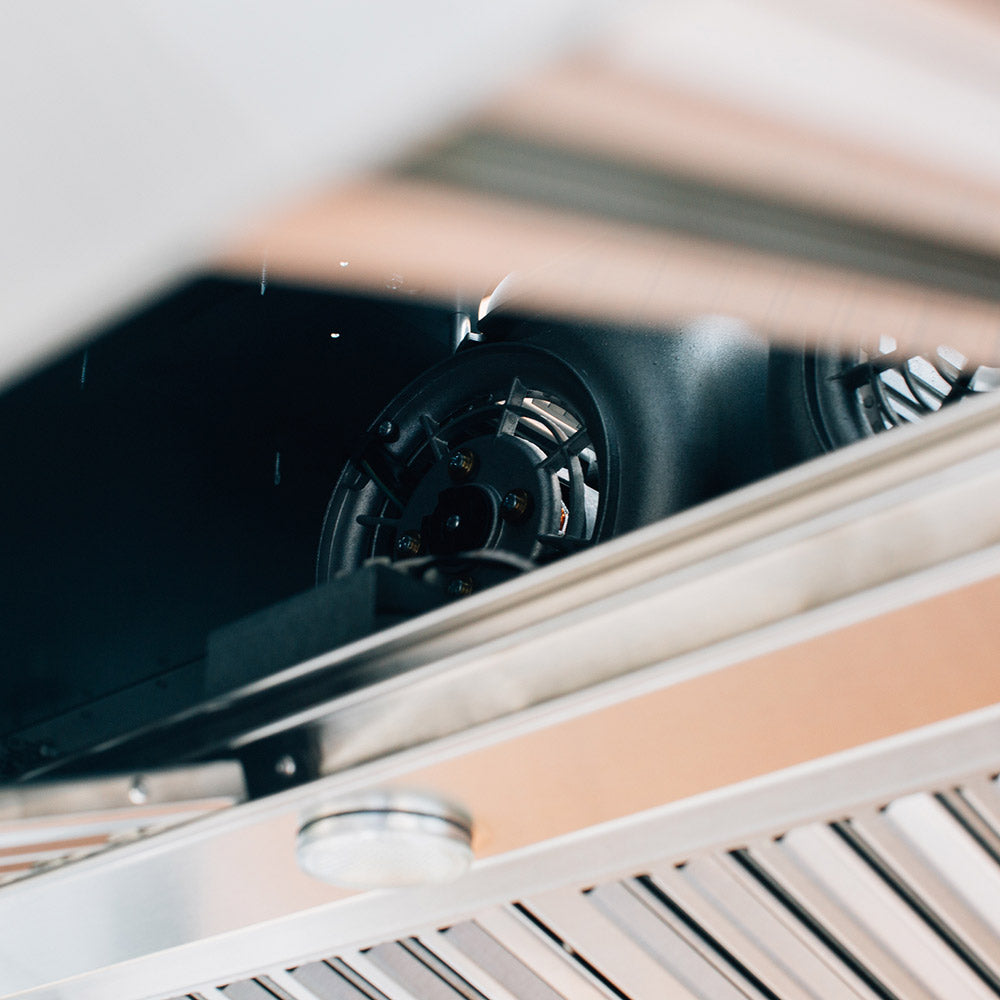Outdoor vent hood blower fan inside the stainless steel housing and vent duct
