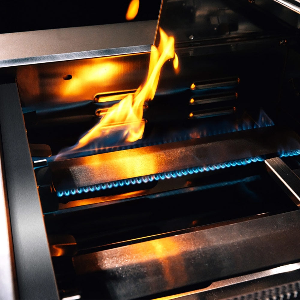 Built-in gas grill burner with visible flames over the cooking area