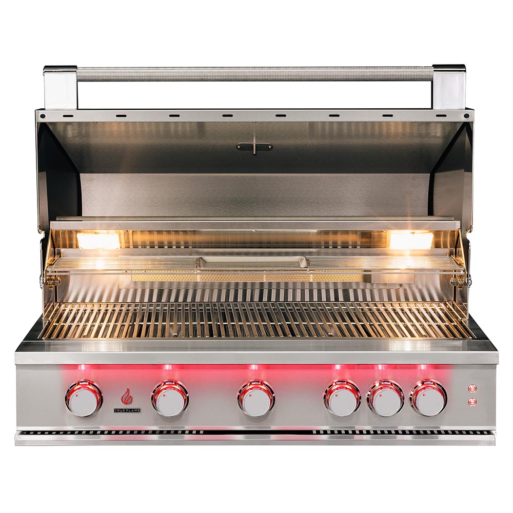 Built-in gas grill with open lid, stainless interior grates, and glowing burner bars