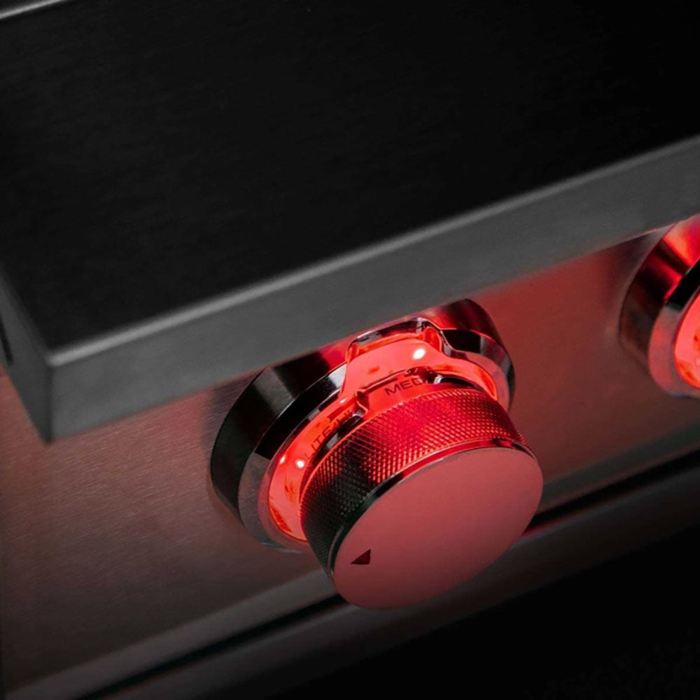 Side burner control knob with red-lit dial on stainless steel front