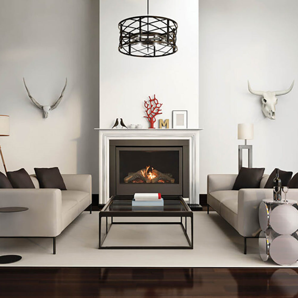 Direct vent gas fireplace in a white mantel with black firebox and burning logs